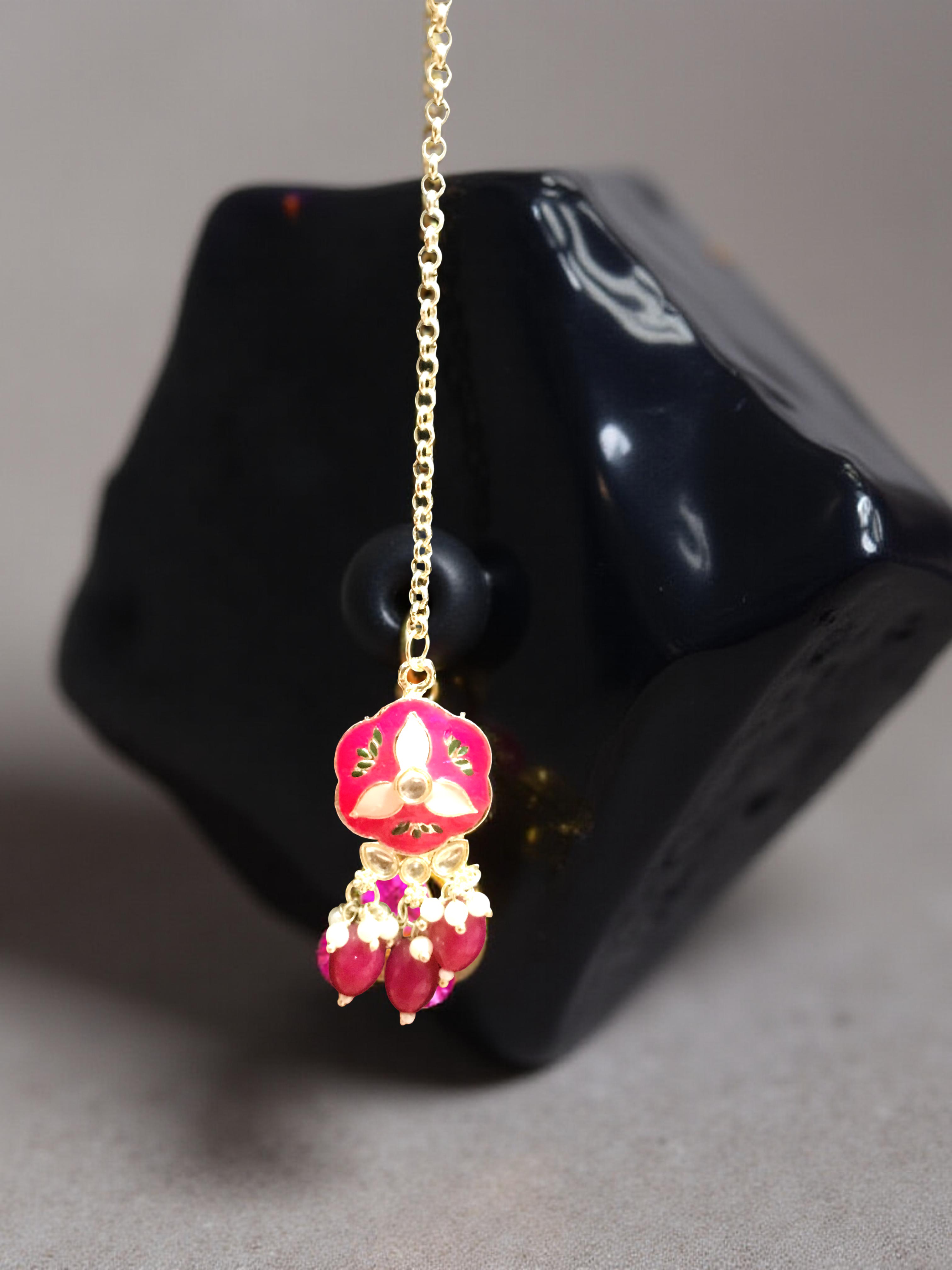 Red floral artificial jewellery choker set with earrings and maang tikka