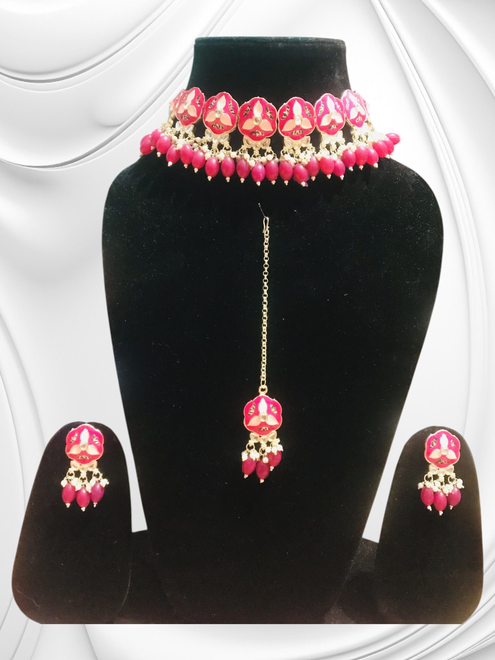 Red floral artificial jewellery choker set with earrings and maang tikka